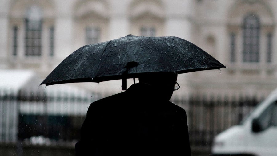 Man with umbrella black and white