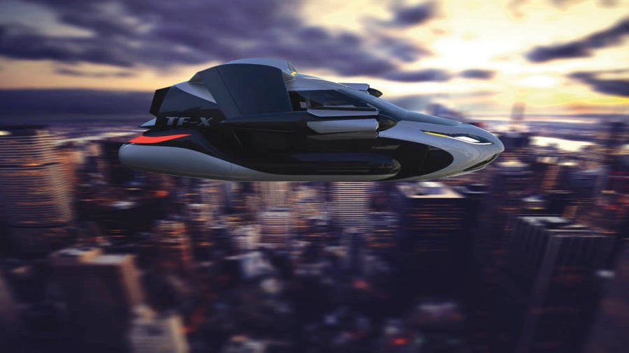 Terrafugia flying taxi car in front of blurred city scape