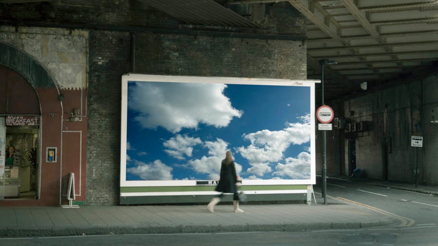 digital agencies woman on street passing billboard