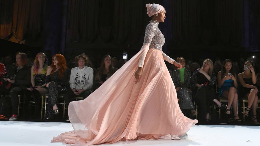 woman in modest fashion on the catwalk