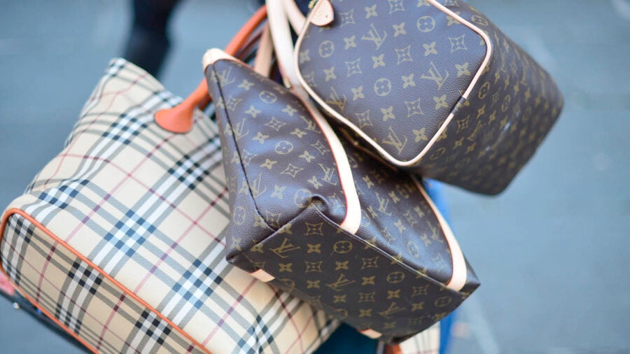 Picture of counterfeit luxury handbags by Burberry and Louis Vuitton