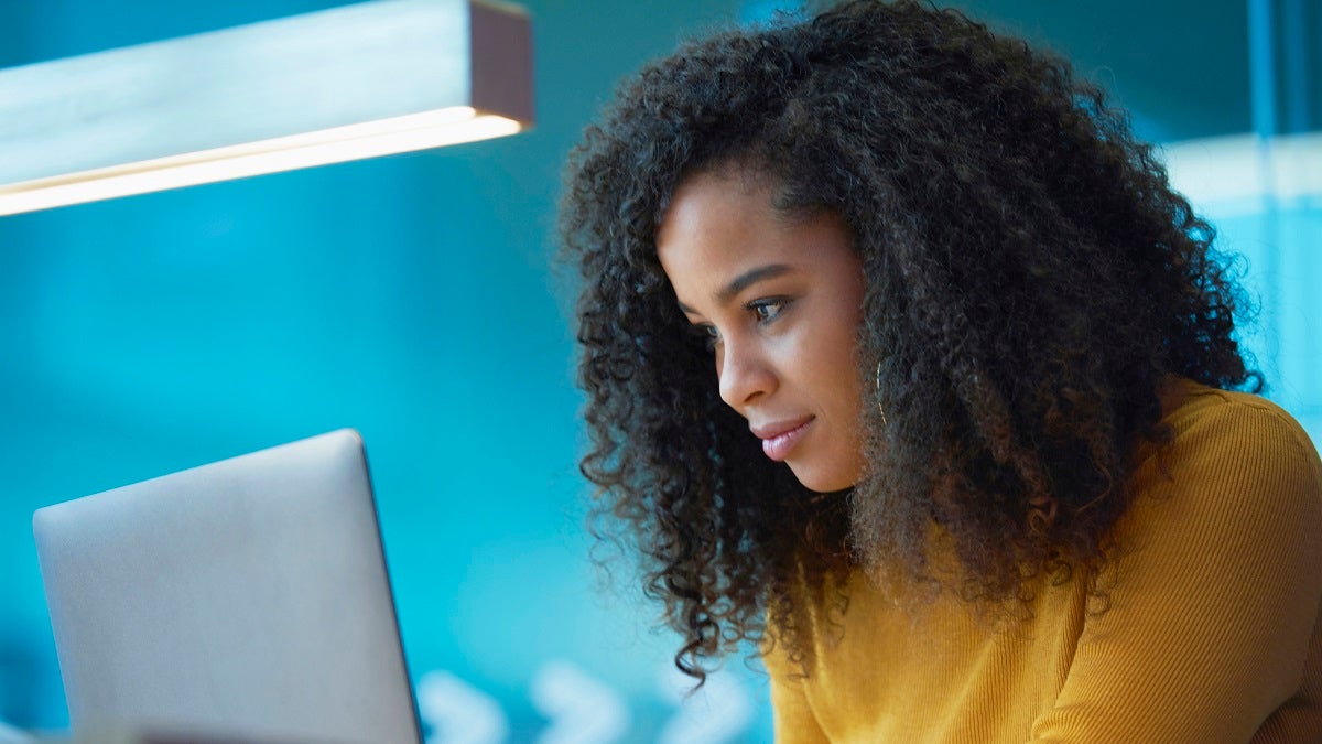 young woman on laptop in office