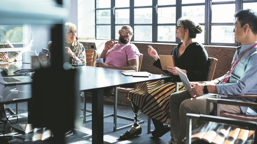 Meeting with group of people in an office