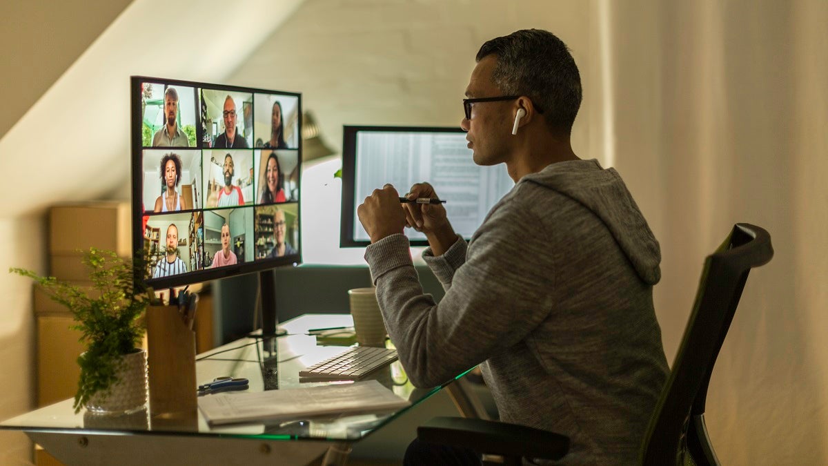 Businessman on video call from home office