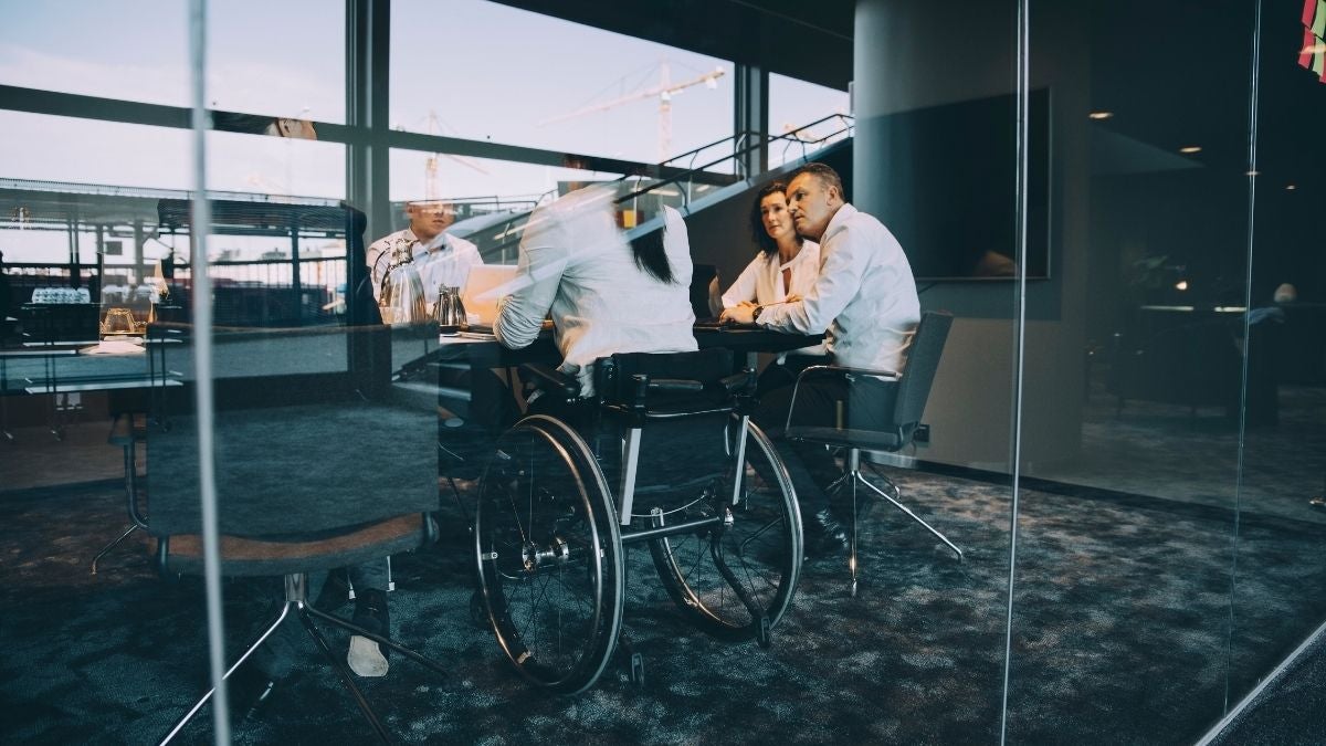 Wheelchair user in boardroom