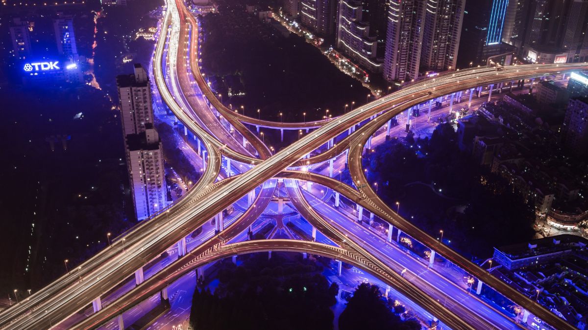 Lit city road junction at night