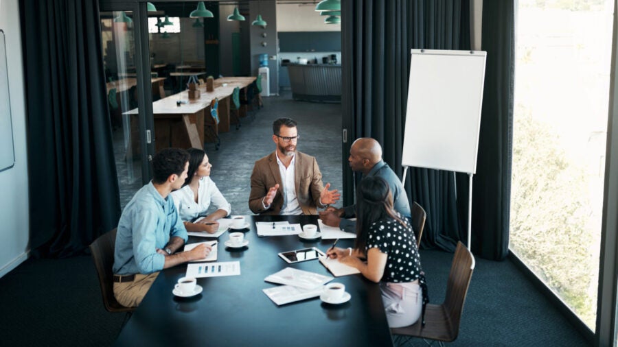 A group of colleagues having a discussion in a modern office