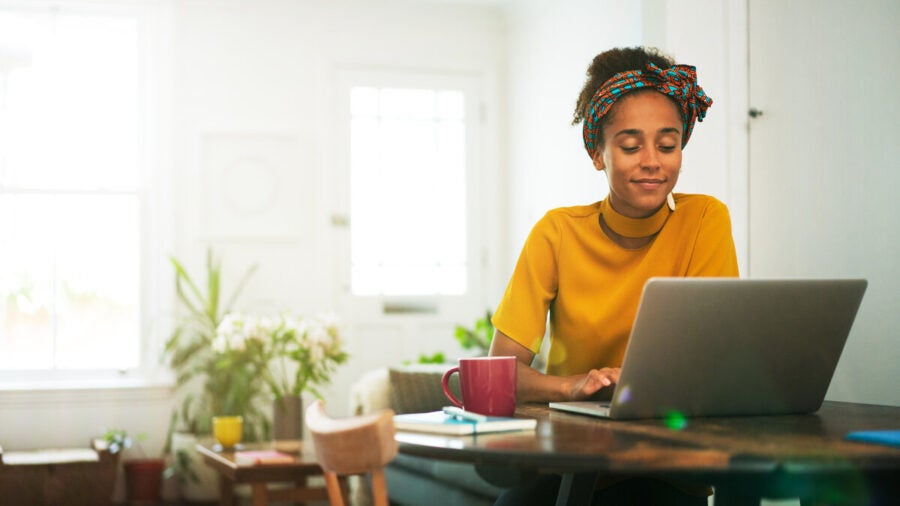 Woman using a laptop to access her bank account