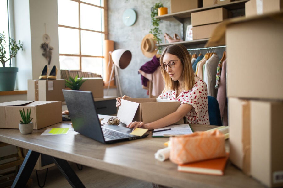 Female Entrepreneur Preparing New Orders For Online Customers