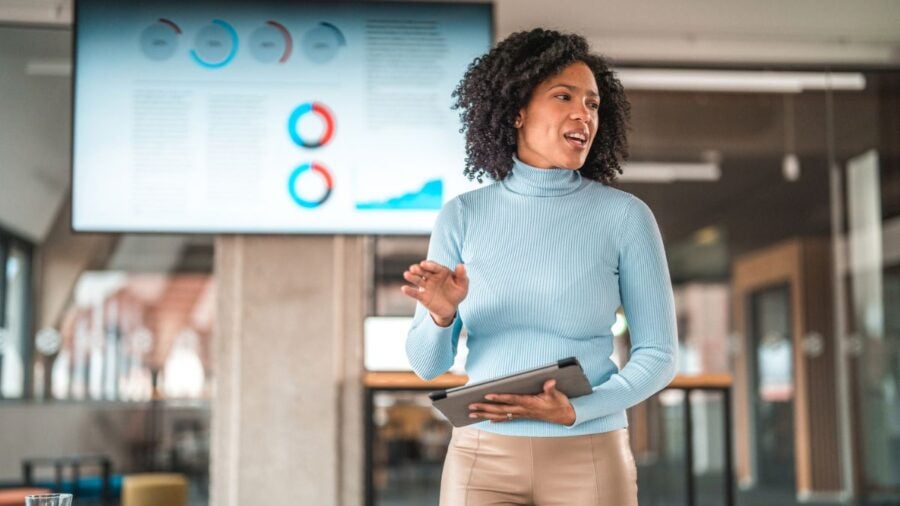 A woman giving a presentation on business expansion