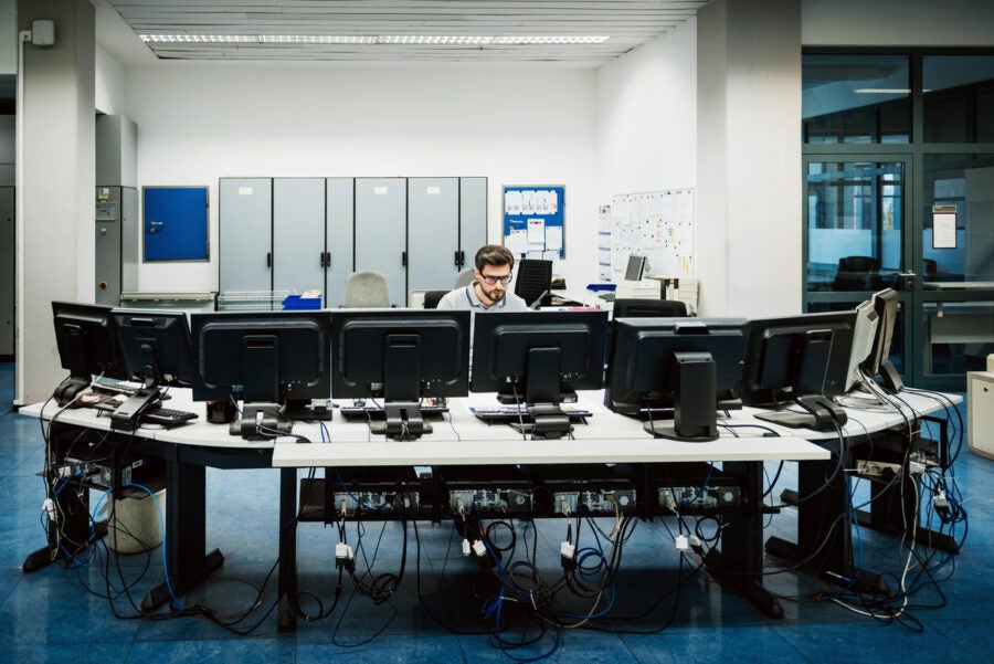 Engineer Working In Big Control Room