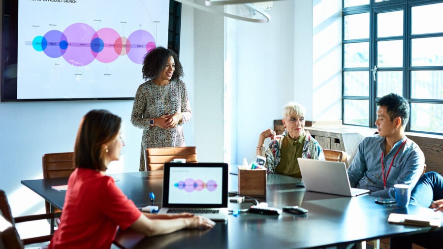 Businesswoman presenting a strategy plan in a meeting room